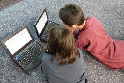 laptop-computer-girl-play-floor-boy